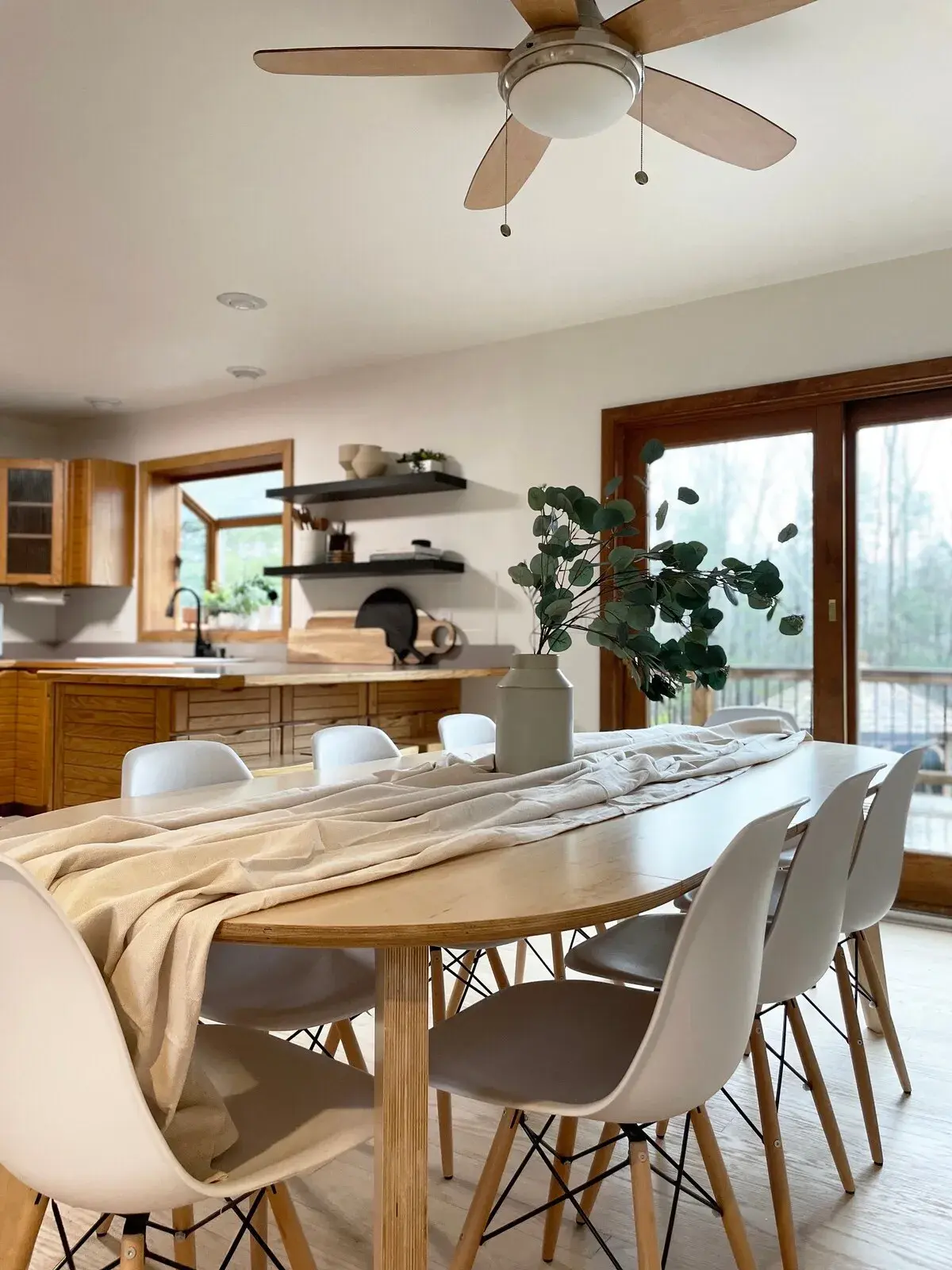 The open-plan kitchen and dining room; the table seats eight