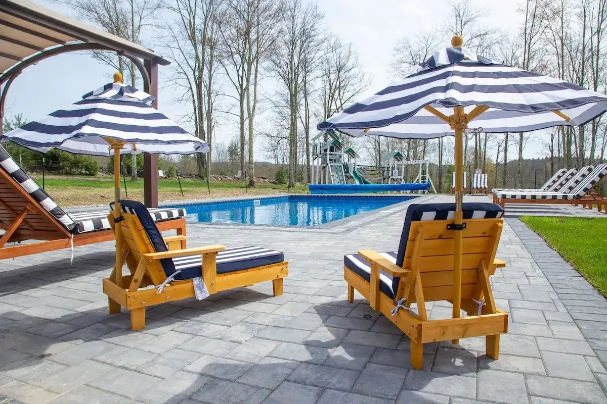 Loungers and striped umbrellas on the pool deck