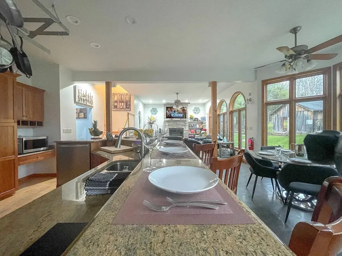 The long kitchen counter and dining area
