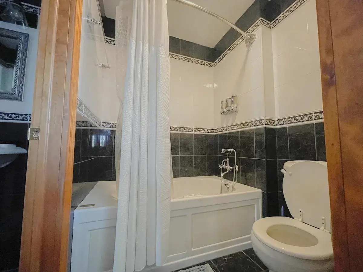A bathroom with a jetted tub