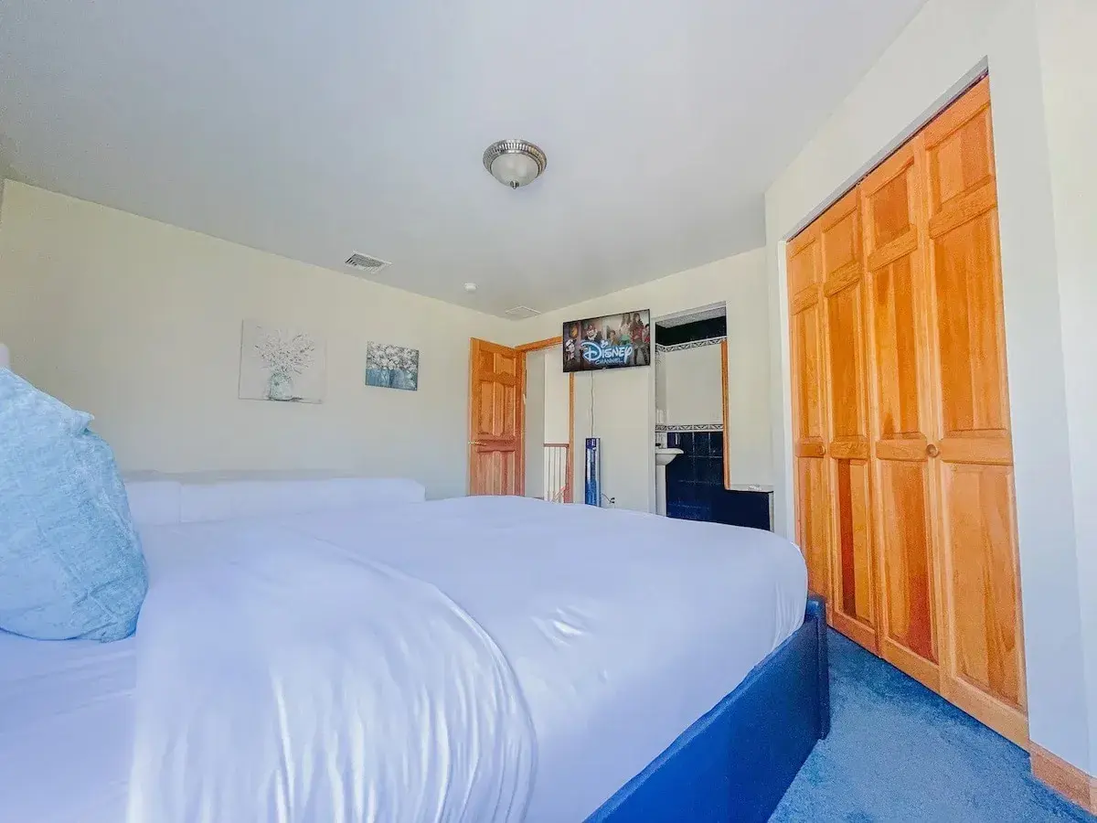 A bedroom with built-in closets