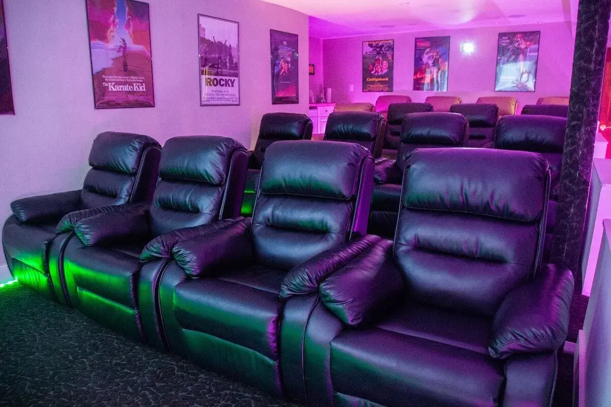 The 16-seat theater, leather recliners in rows