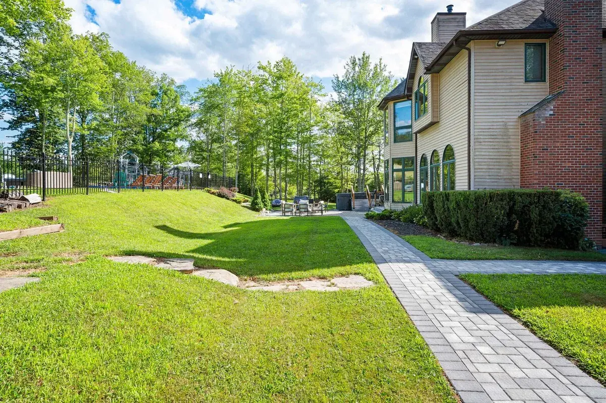 The lawn and path beside the house