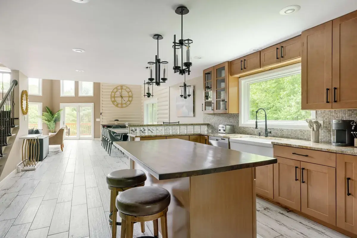 The kitchen island under pendant lights