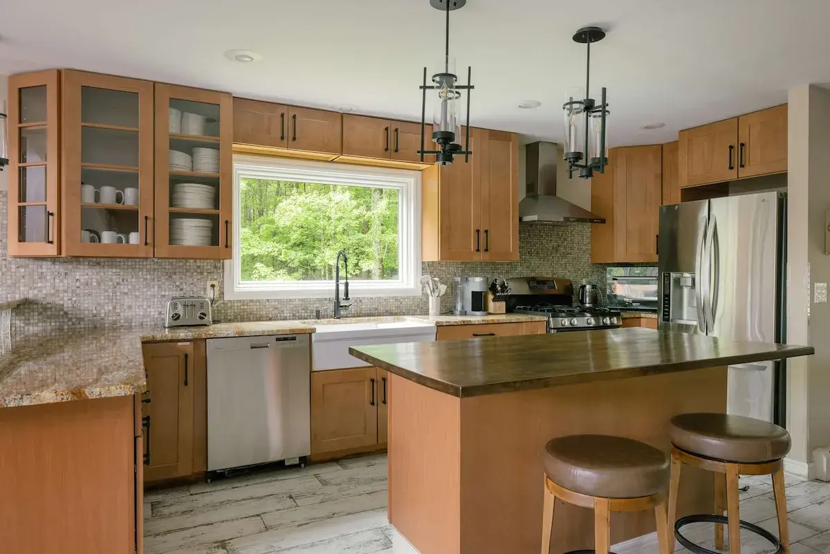 The kitchen, stainless appliances and a window over the sink